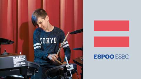 Cover of the Espoo Magazine 4/2021: a boy playing drums, next to the picture the symbol of the Espoo Magazine.