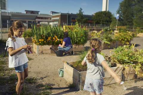 Two children playing at the urban farming site in Kera.