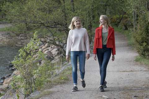 Two young women walking along Espoo’s Waterfront Walkway